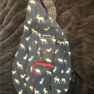 KAVU Navy Sling Bag with Red Accents